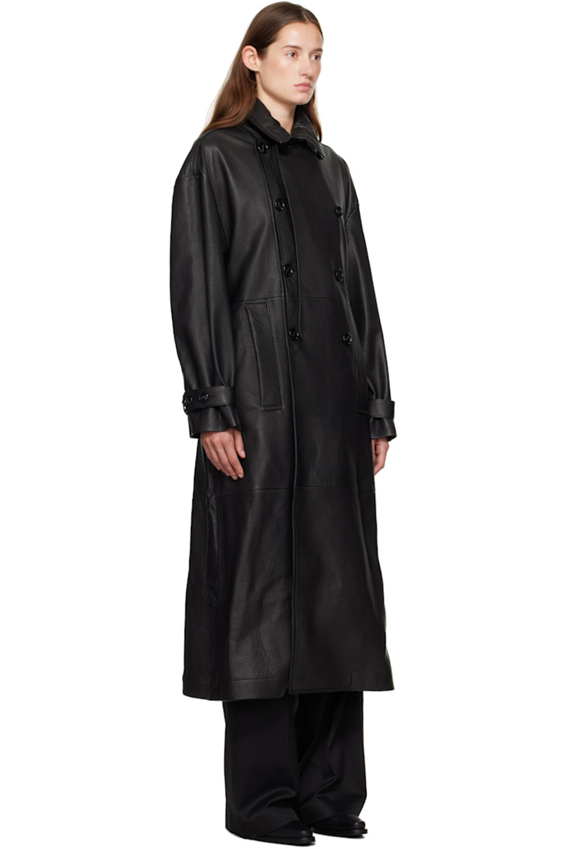 Grained lambskin trench coat. 

· Loops and pin-buckle strap at notched lapel 
· Double-breasted button closure
· Welt pockets at front 
· Belt loops 
· Detachable pin-buckle belt at waist
· Welt pockets at interior 
· Partial satin lining 

Supplier color: Black