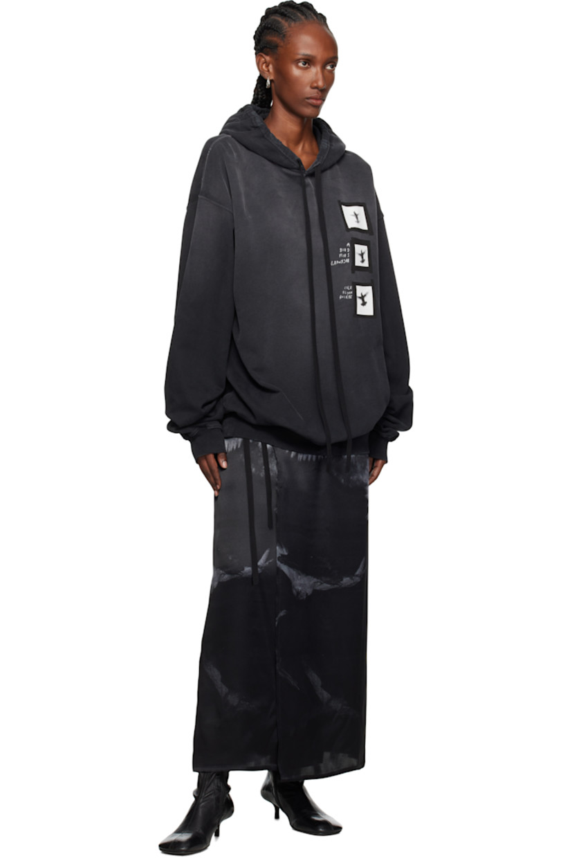 Cotton French terry hoodie. 

· Fading and distressing throughout 
· Drawstring at hood
· Text and graphics printed at front
· Rib-knit hem and cuffs
· Dropped shoulders
· Detachable webbing strap with logo plaque at interior

Supplier color: Faded black
