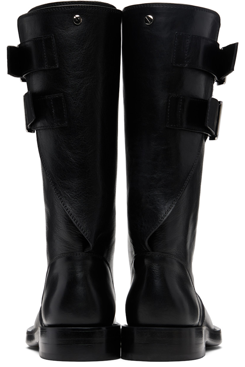 Mid-calf grained calfskin boots.

· Rivet and pin-buckle straps at collar 
· Stacked leather midsole and block heel
· Suede sole with rubber injection

Supplier color: Black
