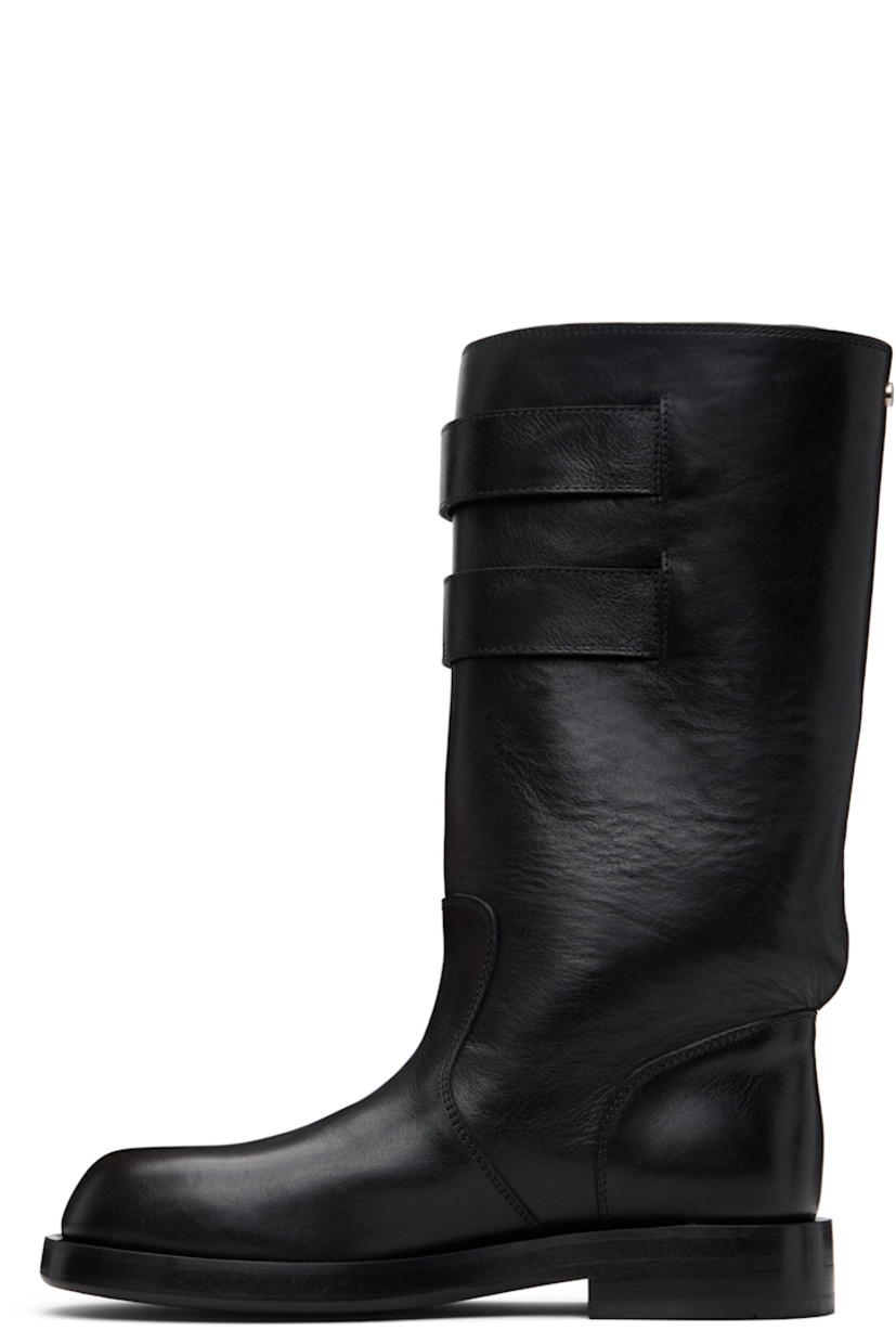 Mid-calf grained calfskin boots.

· Rivet and pin-buckle straps at collar 
· Stacked leather midsole and block heel
· Suede sole with rubber injection

Supplier color: Black