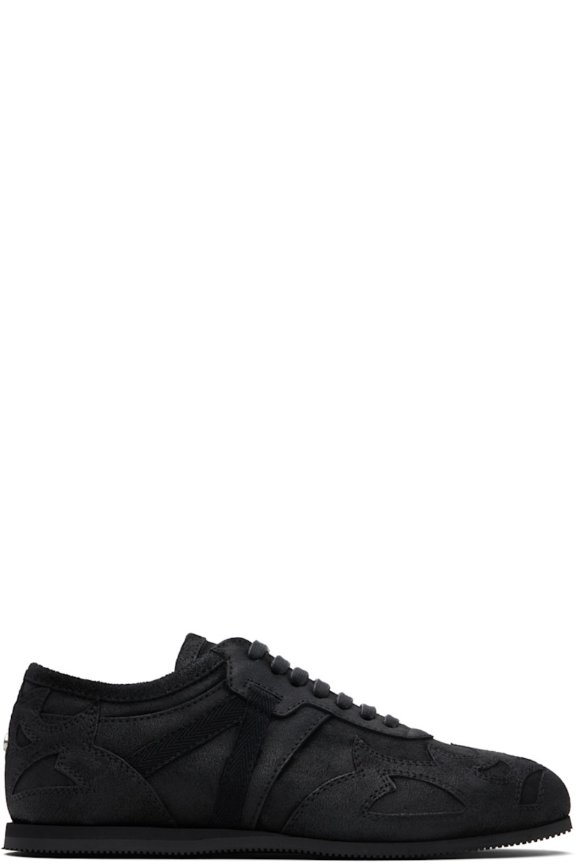 Low-top paneled and blistered calfskin sneakers.

· Lace-up closure
· Logo patch at padded tongue
· Grosgrain trim at sides
· Rivet at heel counter 
· Treaded foam rubber sole 

Supplier color: Black
