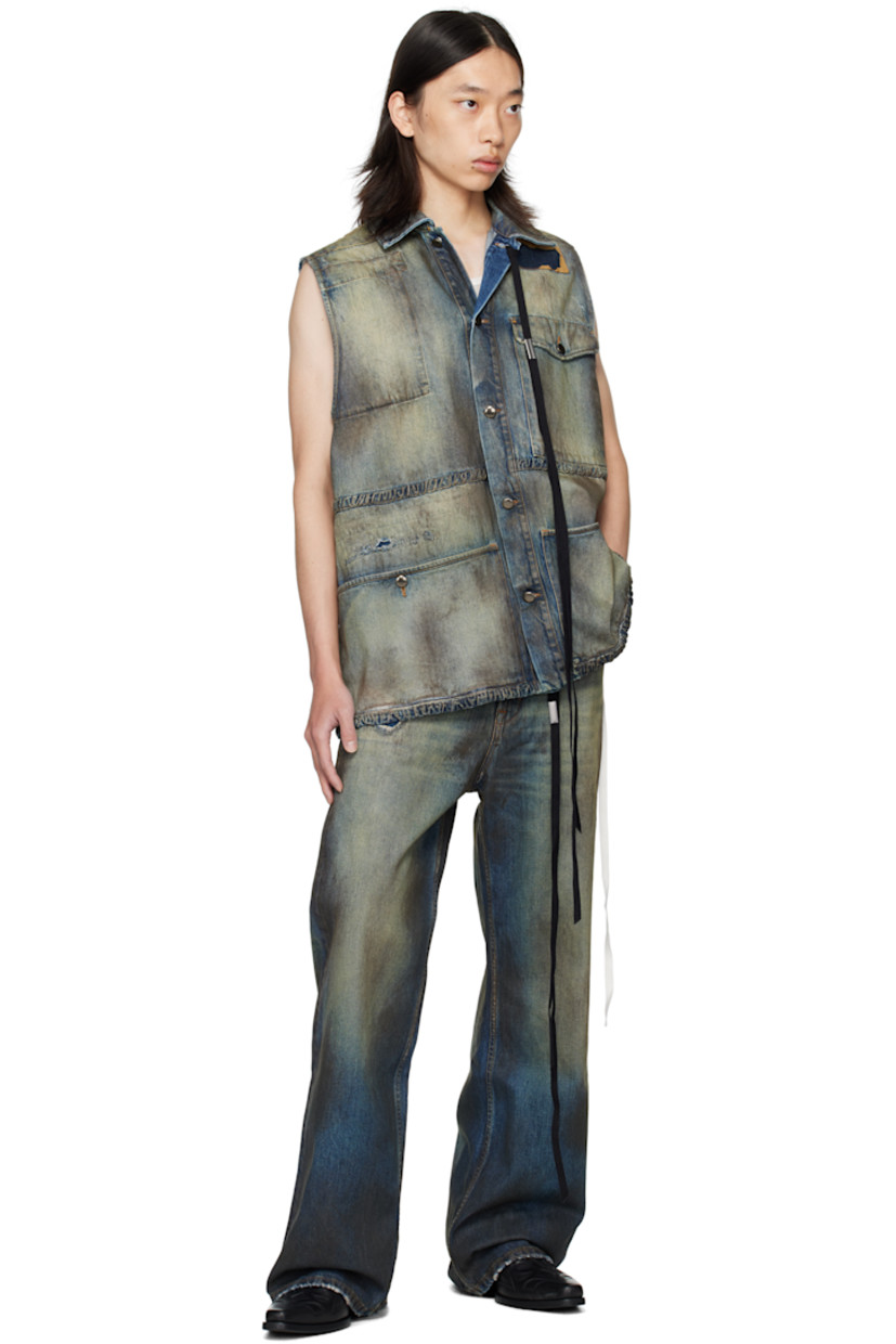 Sleeveless non-stretch denim jacket. 

· Discoloration, distressing, and sprayed dye throughout
· Topstitched patches throughout
· Spread collar
· Detachable ribbon with logo plaque at collar
· Button closure
· Flap pockets at chest and back waist
· Buttoned patch pockets at waist
· Contrast stitching in brown

Supplier color: Vintage blue