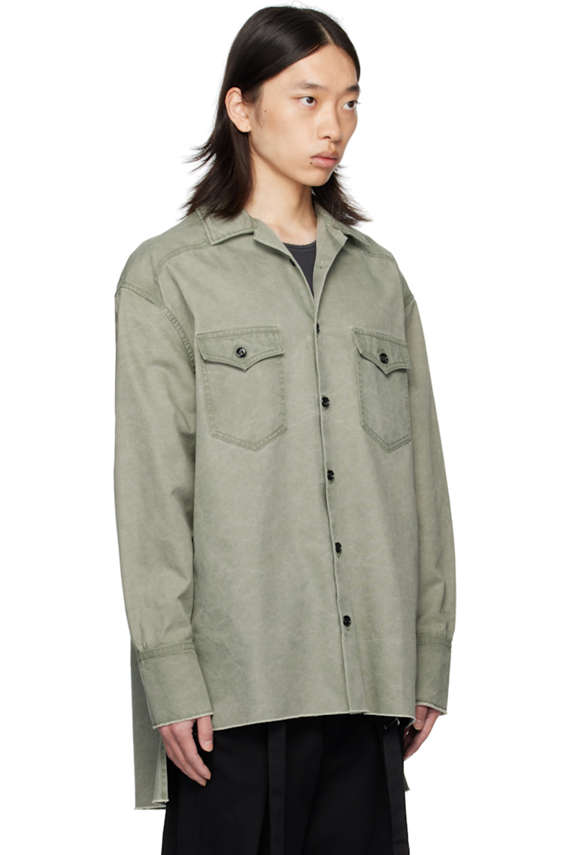 Cotton canvas shirt. 

· Spread collar
· Button closure
· Flap pockets at chest
· Droptail hem
· Raw edge at hem and cuffs
· Buttoned barrel cuffs
· Western-style back yoke

Supplier color: Sage