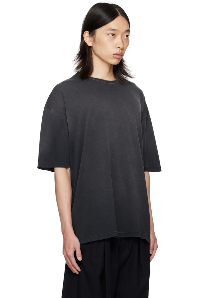 Lightweight cotton jersey T-shirt.

· Fading and distressing throughout
· Rib-knit crewneck
· Dropped shoulders  
· Text and graphic printed at back

Supplier color: Faded black