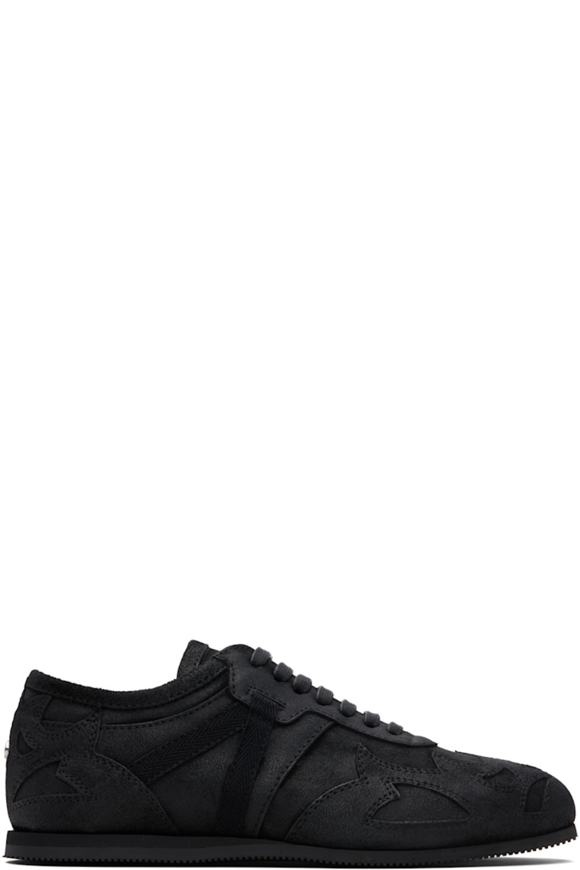 Low-top paneled and blistered calfskin sneakers.

· Lace-up closure
· Logo patch at padded tongue
· Grosgrain trim at sides
· Rivet at heel counter 
· Treaded foam rubber sole 

Supplier color: Black