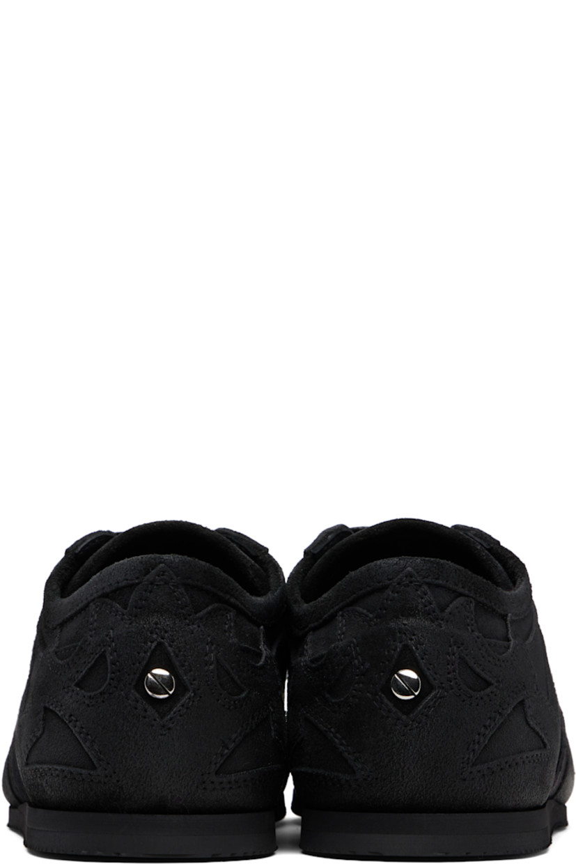 Low-top paneled and blistered calfskin sneakers.

· Lace-up closure
· Logo patch at padded tongue
· Grosgrain trim at sides
· Rivet at heel counter 
· Treaded foam rubber sole 

Supplier color: Black
