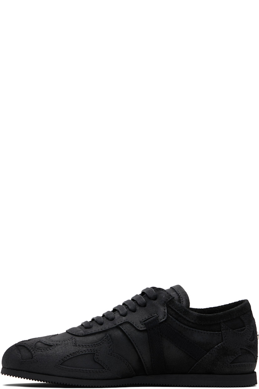 Low-top paneled and blistered calfskin sneakers.

· Lace-up closure
· Logo patch at padded tongue
· Grosgrain trim at sides
· Rivet at heel counter 
· Treaded foam rubber sole 

Supplier color: Black