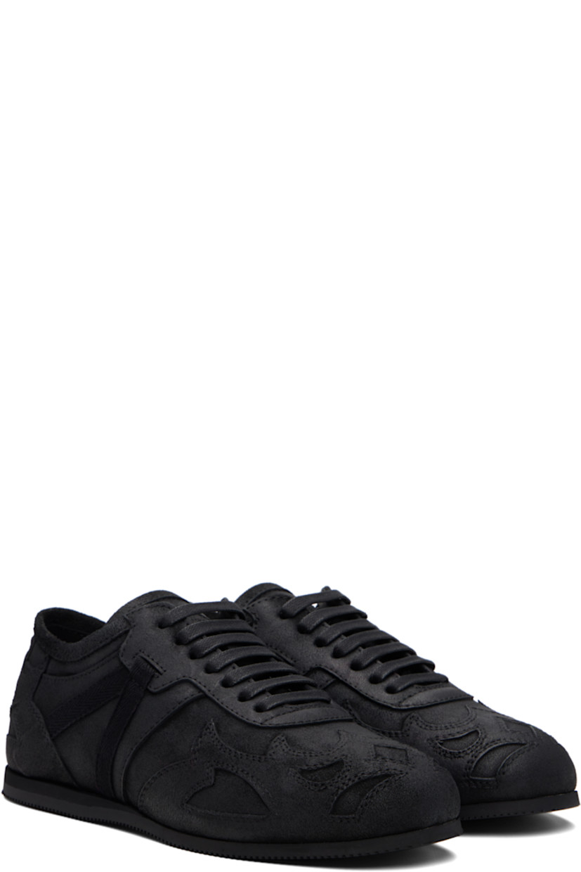 Low-top paneled and blistered calfskin sneakers.

· Lace-up closure
· Logo patch at padded tongue
· Grosgrain trim at sides
· Rivet at heel counter 
· Treaded foam rubber sole 

Supplier color: Black