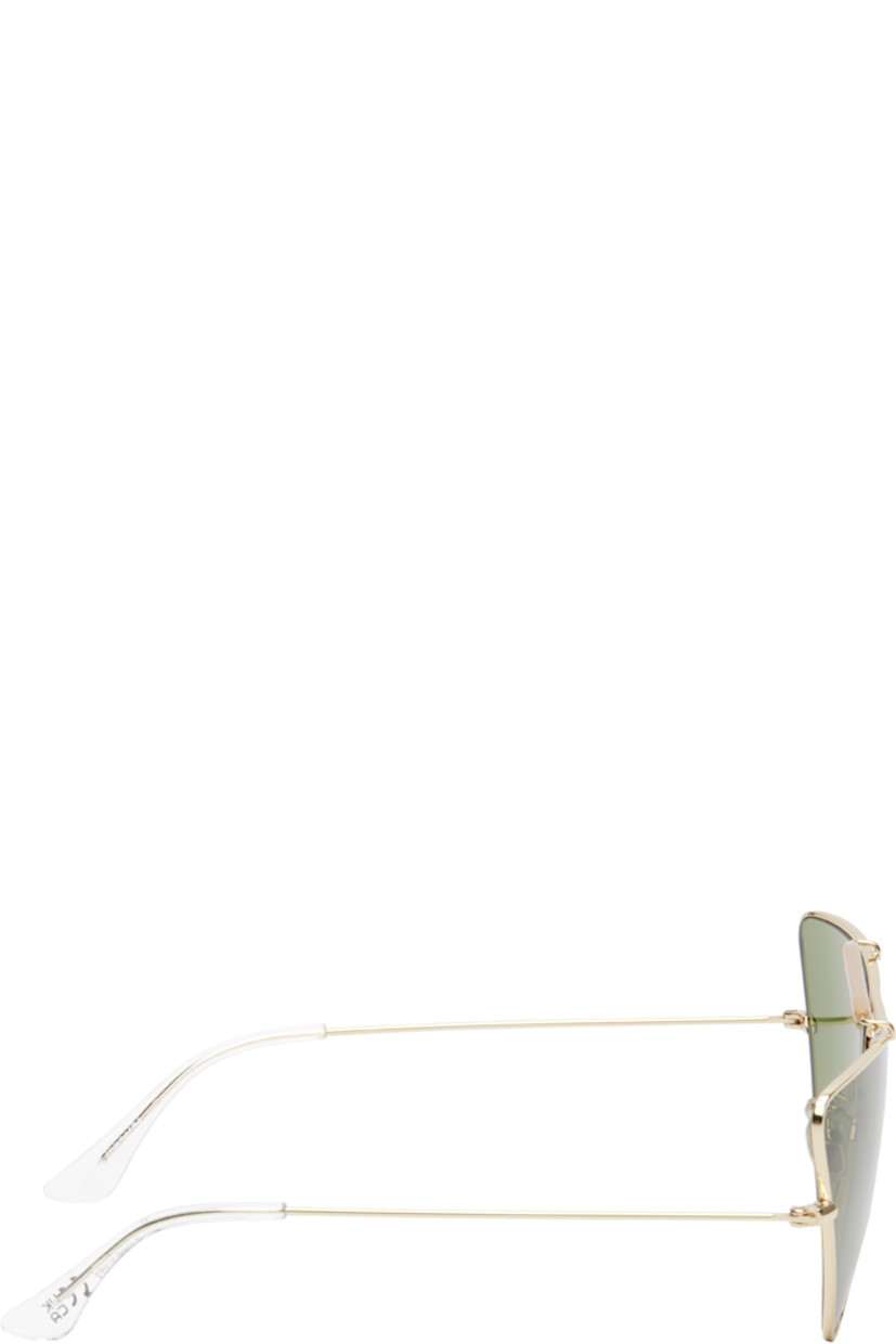 Cat-eye metal-frame sunglasses in gold tone.

· Handcrafted
· Green lenses
· 100% UVA/UVB protection, category 2
· Adjustable rubber nose pads
· Double bridge
· Logo engraved at top bar
· Transparent acetate temple tips
· Includes pouch
· Size: 73.10 145

Supplier color: Gold