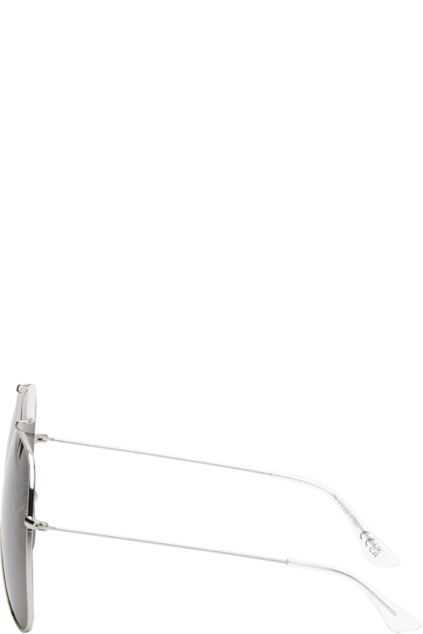 Aviator-style metal-frame sunglasses in silver tone.

· Handcrafted
· Gray lenses
· 100% UVA/UVB protection, category 3
· Adjustable rubber nose pads
· Double bridge
· Logo engraved at top bar
· Transparent acetate temple tips
· Includes pouch
· Size: 67.07 145

Supplier color: Silver