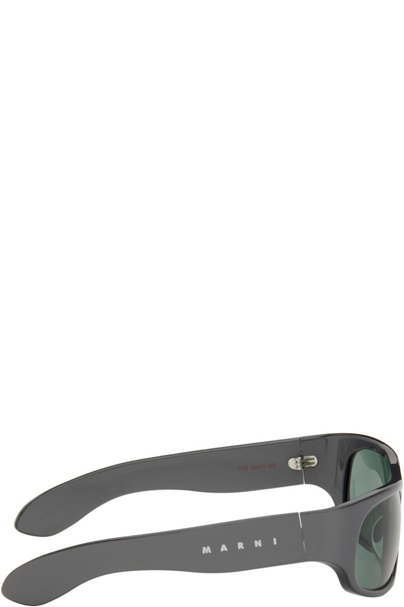 Handcrafted wraparound acrylic-frame sunglasses in gray.

· Blue lenses
· Integrated nose pads
· Logo etched at temples 
· Includes pouch
· Size: 62.17 125

Supplier color: Solid grey