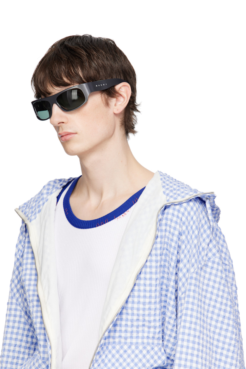 Handcrafted wraparound acrylic-frame sunglasses in gray.

· Blue lenses
· Integrated nose pads
· Logo etched at temples 
· Includes pouch
· Size: 62.17 125

Supplier color: Solid grey