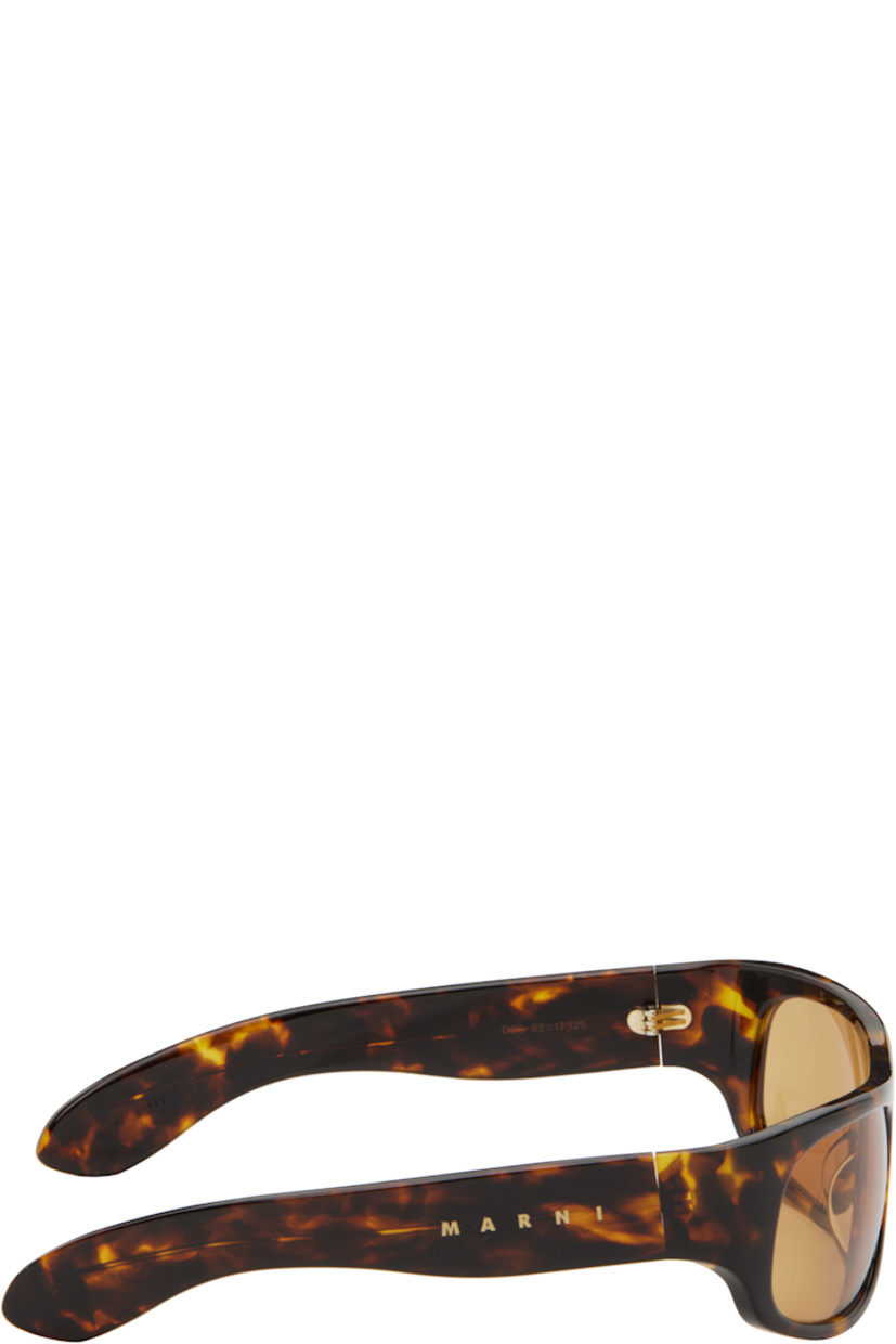 Handcrafted wraparound tortoiseshell acrylic-frame sunglasses in brown and black.

· Orange lenses
· Integrated nose pads
· Logo at temples
· Exposed core wire
· Includes pouch
· Size: 62.17 125

Supplier color: Burnt Havana