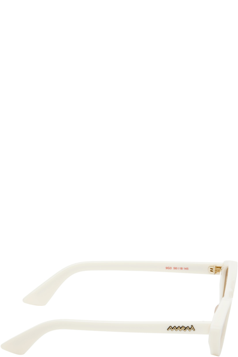 Handcrafted cat-eye acetate-frame sunglasses in white.

· Orange lenses
· 100% UV protection, category 2
· Integrated nose pads
· Gold-tone logo hardware at temples
· Includes pouch
· Size: 56.18 145

Supplier color: Cream