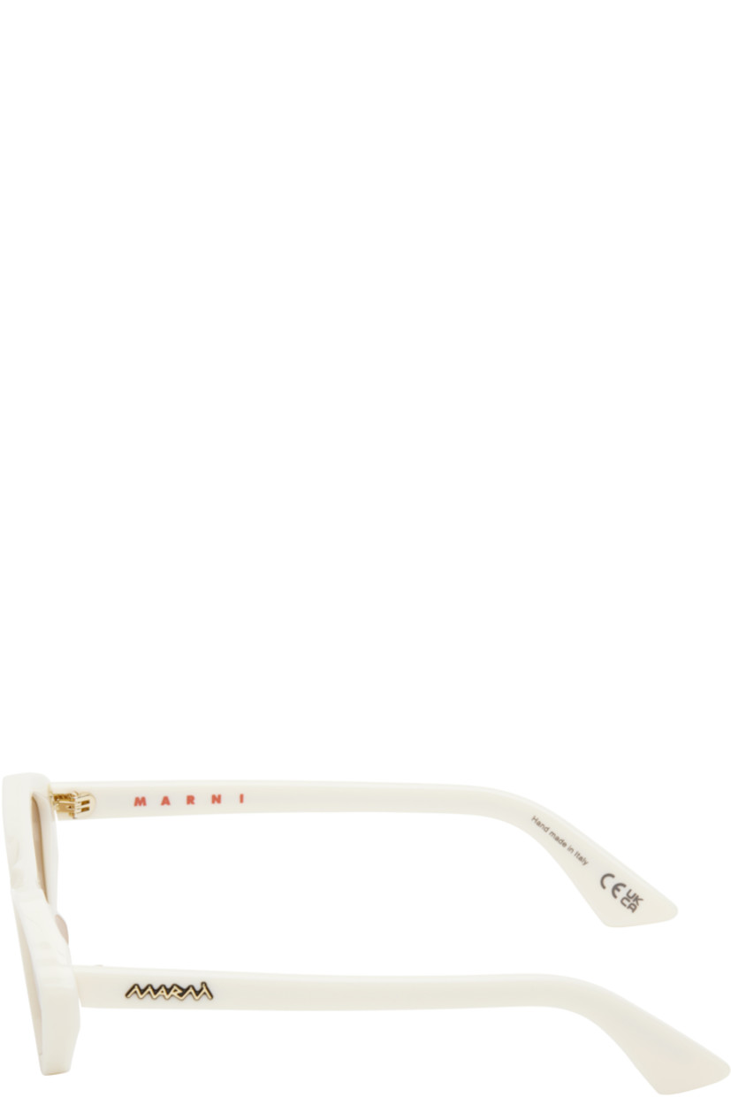 Handcrafted cat-eye acetate-frame sunglasses in white.

· Orange lenses
· 100% UV protection, category 2
· Integrated nose pads
· Gold-tone logo hardware at temples
· Includes pouch
· Size: 56.18 145

Supplier color: Cream