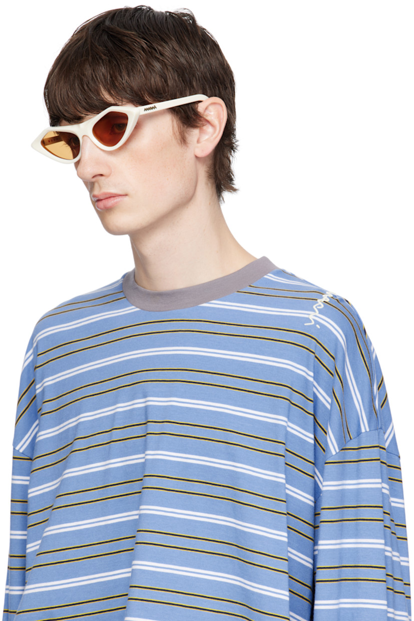 Handcrafted cat-eye acetate-frame sunglasses in white.

· Orange lenses
· 100% UV protection, category 2
· Integrated nose pads
· Gold-tone logo hardware at temples
· Includes pouch
· Size: 56.18 145

Supplier color: Cream