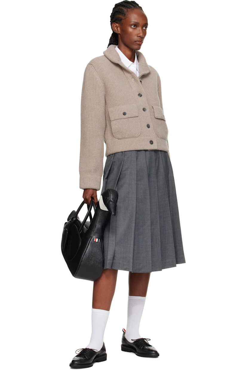 Structured pebble-grained calfskin top handle bag.

· Rolled carry handles with detachable ID holder
· Padded graphic with tricolor loop at side
�· Patch compartment at quilted wings
· Zip closure
· Zip pocket at interior
· Tricolor grosgrain lining
· H8" x W17" x D5"
· Total height: H18"

Supplier color: Black