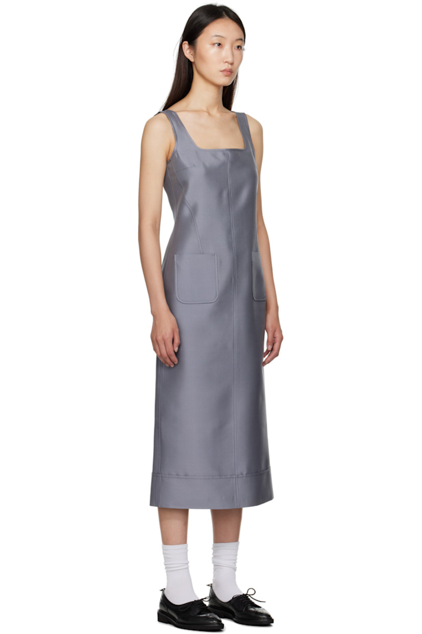 Woven wool- and silk-blend maxi dress.

· Square neck
· Patch pockets at front
· Tricolor loop at back collar
· Zip closure at back
· Vented back hem
· Full silk chiffon lining

Supplier color: Med Grey