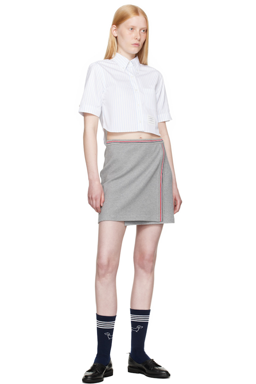 Lightweight waffle-knit cotton miniskirt. 

· Wrap construction
· Tricolor stripes at rib-knit waistband and front
· Logo patch at front hem
· Tricolor grosgrain flag at back waistband
· Unlined

Supplier color: Lt grey