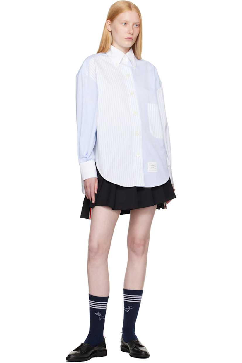Wool fresco miniskirt. Knife pleats throughout.

· Adjustable button tab at waistband
· Tricolor grosgrain trim at vented droptail hem
· Concealed zip closure at side
· Tricolor grosgrain flag at back waistband
· Full sateen lining

Supplier color: Black