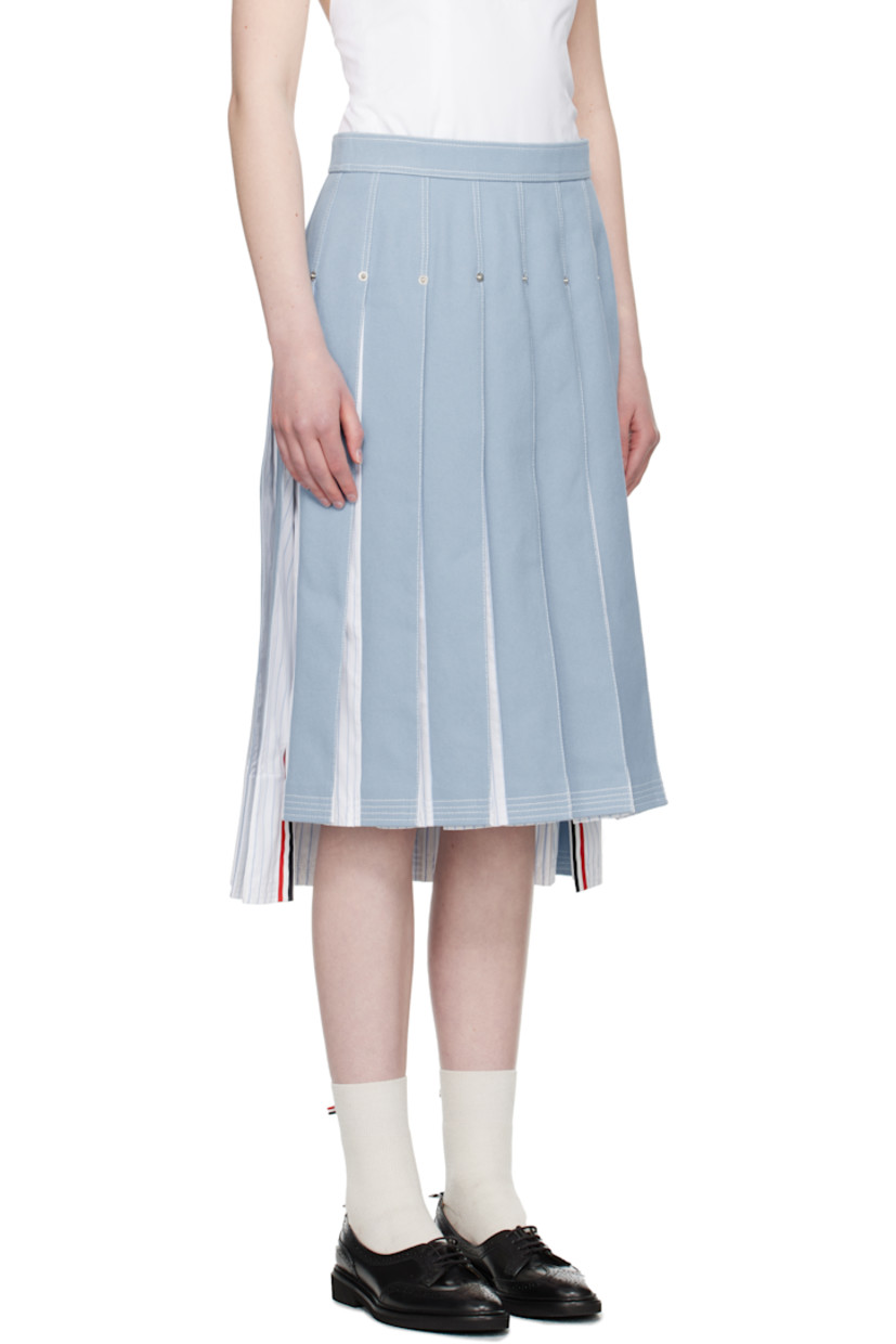 Non-stretch denim and cotton poplin midi skirt. Pleats, stripes, logo-engraved rivets throughout.

· Paneled construction 
· Adjustable button tab at waistband
· Tricolor grosgrain flag at back waistband 
· Full poplin lining
· Contrast stitching in white 

Supplier color: Light blue