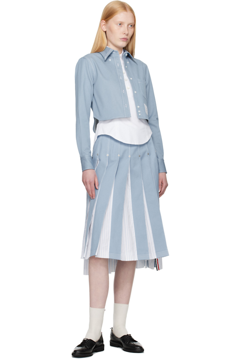 Non-stretch denim and cotton poplin midi skirt. Pleats, stripes, logo-engraved rivets throughout.

· Paneled construction 
· Adjustable button tab at waistband
· Tricolor grosgrain flag at back waistband 
· Full poplin lining
· Contrast stitching in white 

Supplier color: Light blue