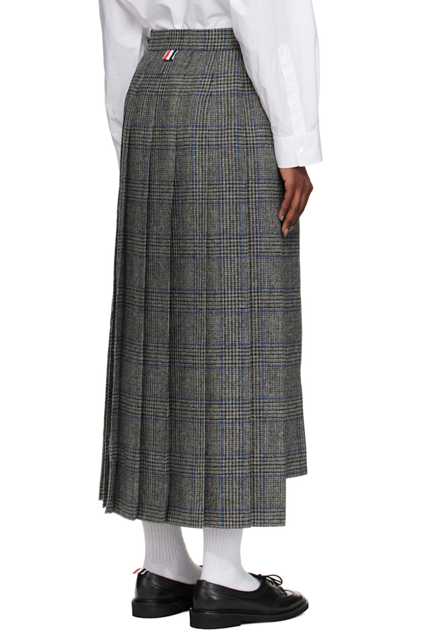 Wool tweed maxi skirt. 

· Prince of Wales pattern and pleats throughout 
· Embroidered graphic appliqués at front 
· Tricolor grosgrain trim at vented droptail hem 
· Button tab and concealed zip closure at side seam
· Tricolor grosgrain flag at back waistband
· Full satin lining 

Supplier color: Med grey