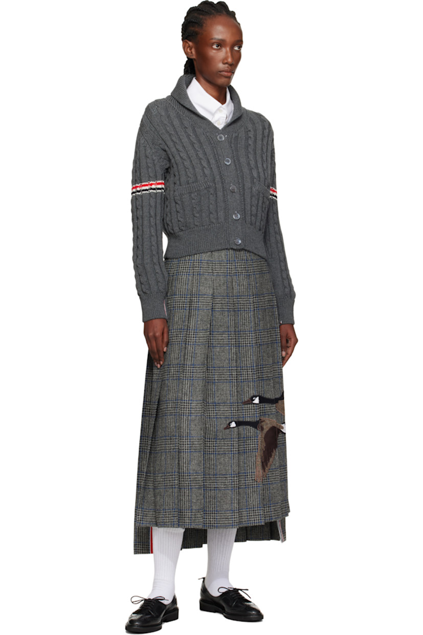 Wool tweed maxi skirt. 

· Prince of Wales pattern and pleats throughout 
· Embroidered graphic appliqués at front 
· Tricolor grosgrain trim at vented droptail hem 
· Button tab and concealed zip closure at side seam
· Tricolor grosgrain flag at back waistband
· Full satin lining 

Supplier color: Med grey