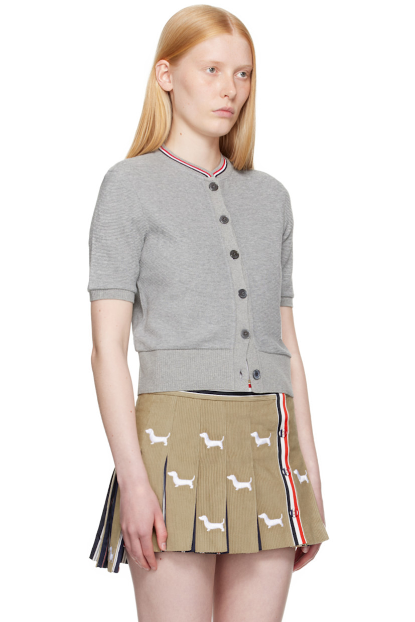 Lightweight waffle-knit cotton cardigan. 

· Tricolor stripes at rib-knit crewneck
· Button closure
· Logo patch at front
· Rib-knit hem and cuffs
· Tricolor grosgrain flag at back collar

Supplier color: Lt grey