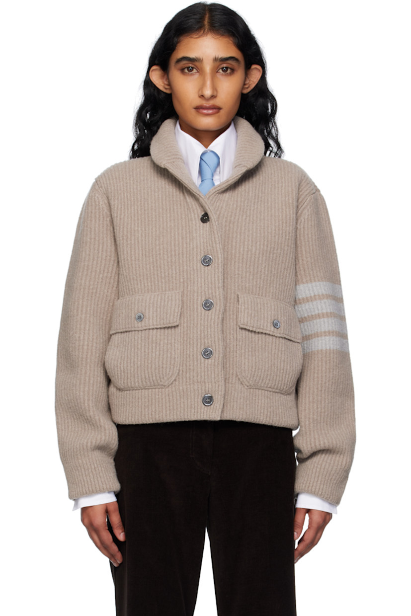 Rib-knit wool-blend cardigan.

· Shawl collar
· Button closure
· Flap pockets
· Stripes at sleeve
· Tricolor grosgrain flag at back collar

Supplier color: Med brown
