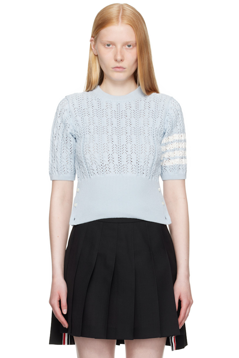 Pointelle-knit cotton sweater. Cable-knit detailing throughout.

· Rib-knit crewneck, hem, and cuffs
· Button vent at side seams with tricolor grosgrain trim
· Intarsia stripes at sleeve
· Tricolor grosgrain flag at back collar

Supplier color: Light blue