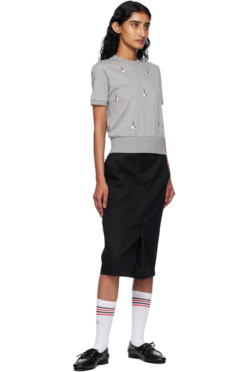 Cotton jersey T-shirt.

· Embroidered graphic pattern throughout
· Rib-knit crewneck, hem, and cuffs
· Logo patch at front hem 
· Tricolor loop at back collar

Supplier color: Lt grey