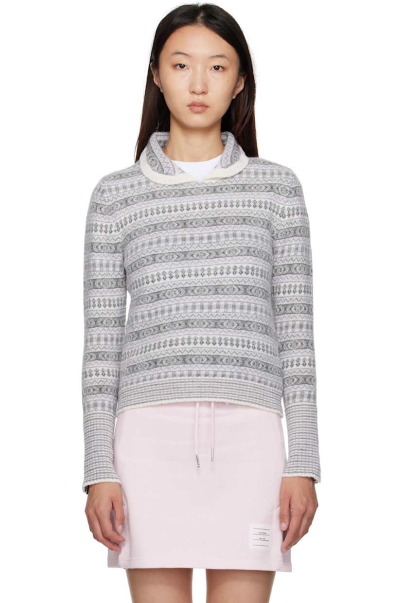 Knit merino wool-blend sweater.

· Jacquard pattern throughout
· Rib-knit Peter Pan collar, hem, and cuffs
· Tricolor loop at back collar

Supplier color: White