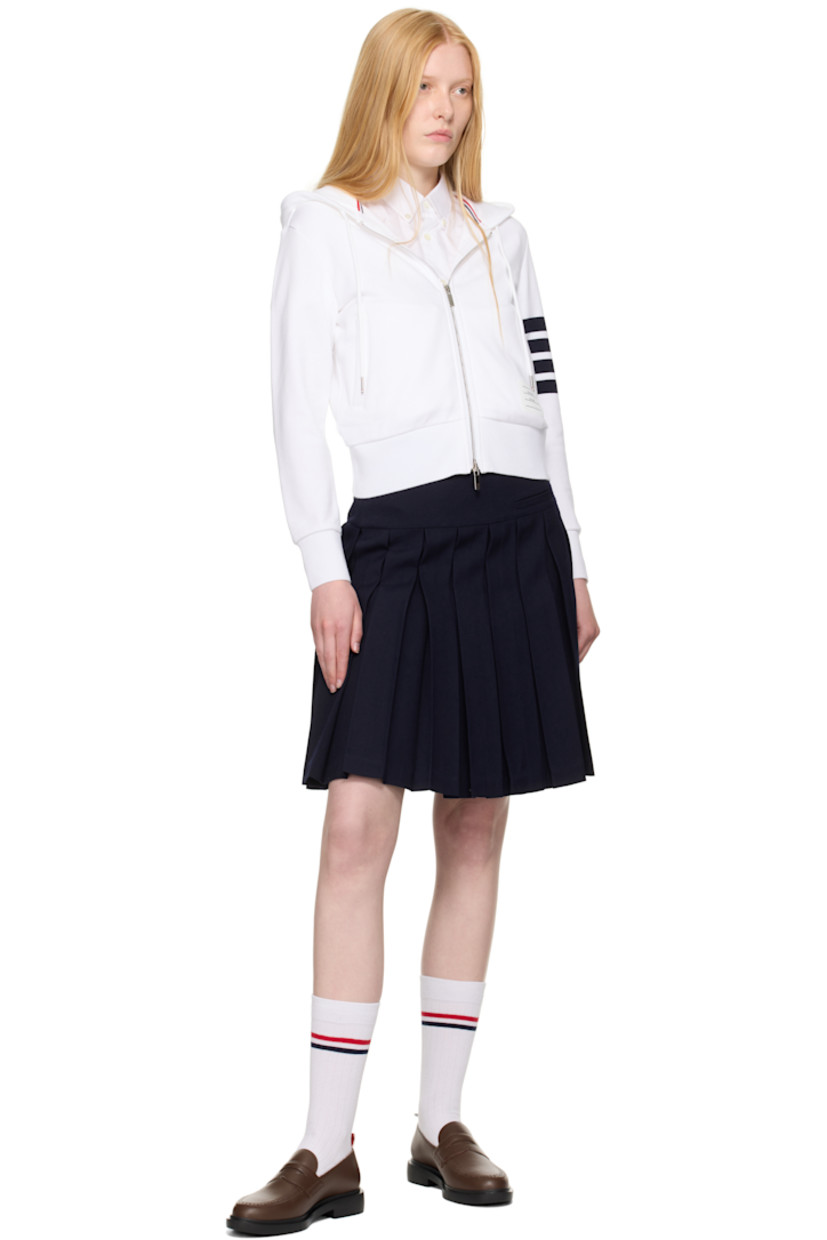 French terry hoodie. 

· Drawstring at hood
· Rib-knit hood, hem, and cuffs
· Two-way zip closure 
· Welt pockets
· Logo patch at front  
· Stripes at sleeve
· Tricolor grosgrain flag at back collar

Supplier color: White/Navy