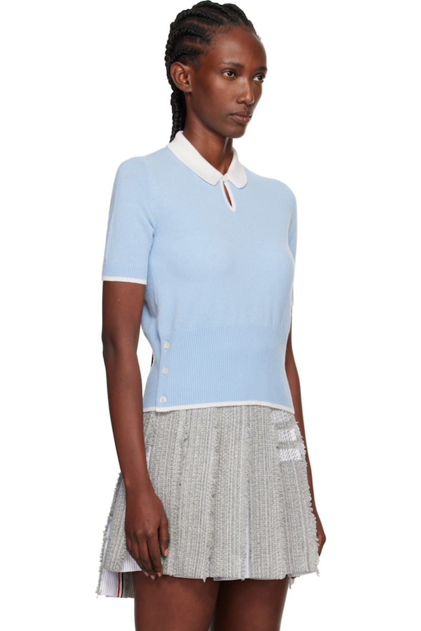Knit cashmere polo.

· Rib-knit spread collar, cuffs, and hem
· Button keyhole at collar
· Buttoned vent at side seams
· Concealed tricolor trim at vents
· Tricolor flag at back collar

Supplier color: Light Blue