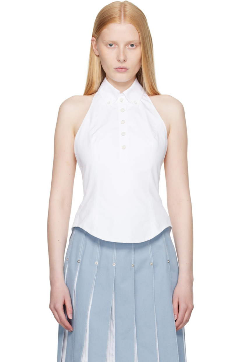 Cotton poplin top. 

· Button-down spread collar
· Fixed halter strap
· Five-button placket
· Curved hem 
· Tricolor grosgrain flag at back collar
· Button fastening at open back
· Central vent at back hem 

Supplier color: White