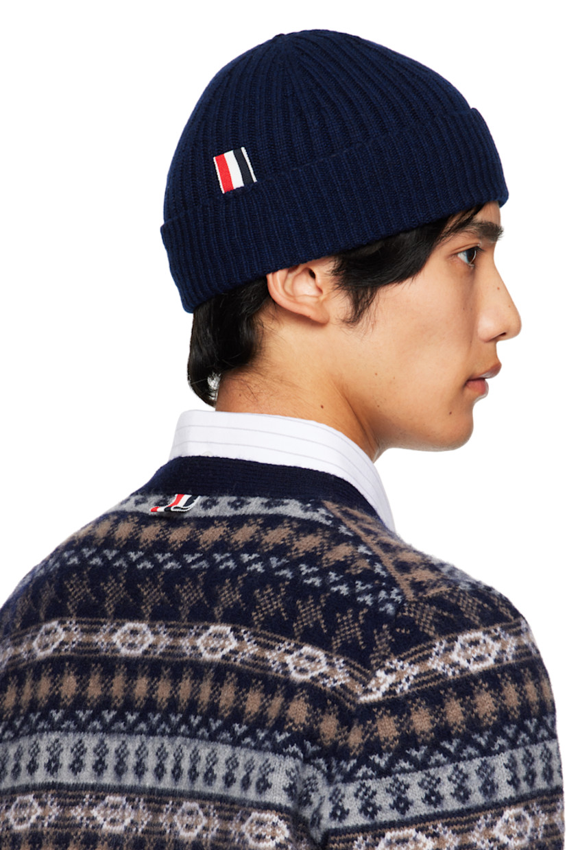 Rib-knit cashmere beanie.

· Intarsia stripes at rolled brim
· Tricolor grosgrain flag at back face

Supplier color: Navy