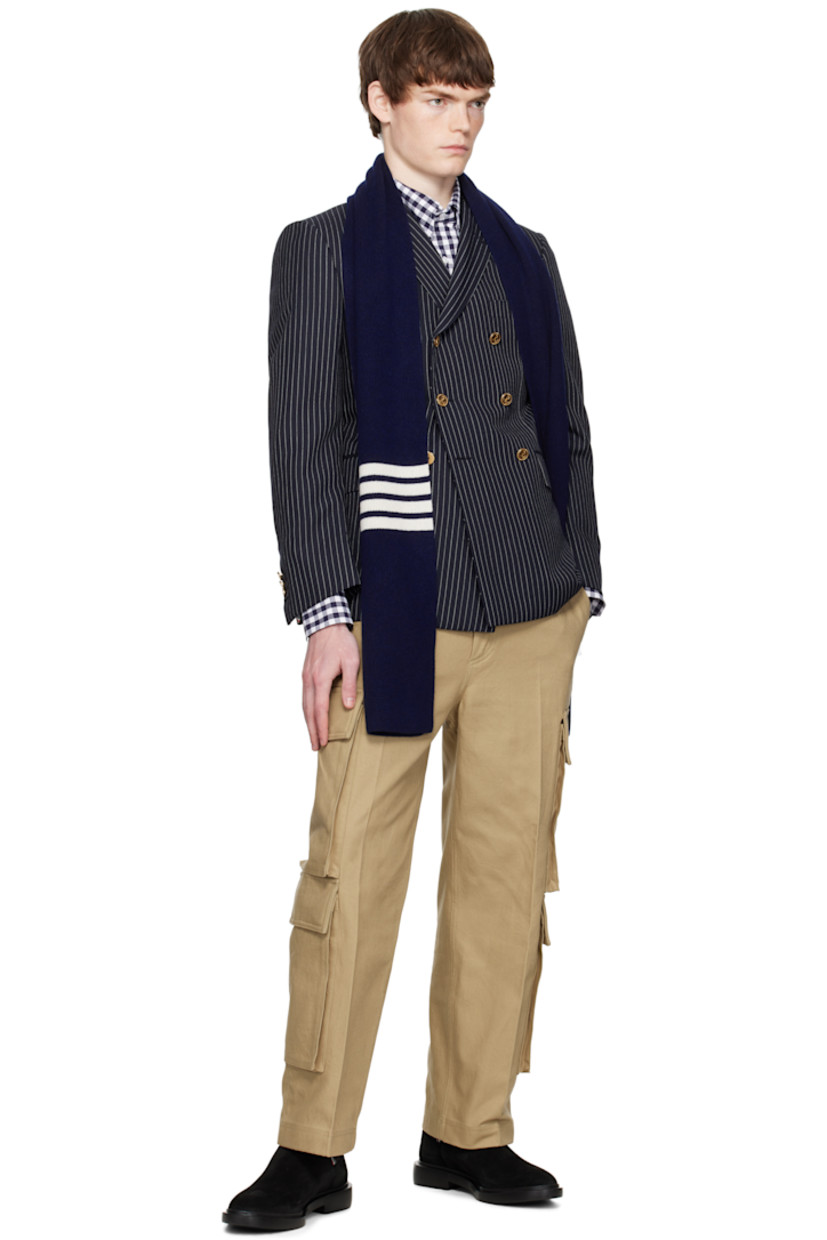 Rectangular rib-knit cashmere scarf.

· Jacquard stripes at length
· Tricolor grosgrain flag at end
· L80" x W9"

Supplier color: Navy