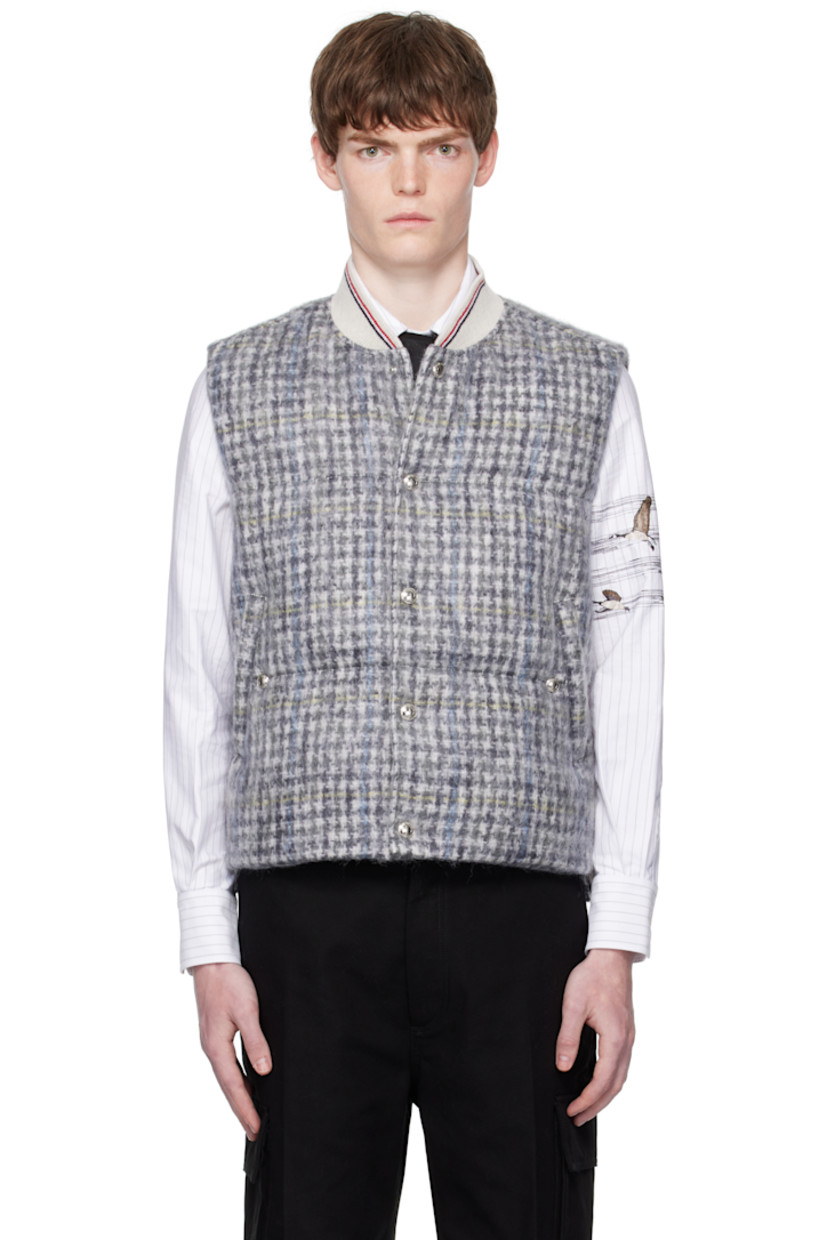 Down-filled and quilted mohair-blend tweed vest.

· Check pattern throughout
· Striped rib-knit stand collar
· Press-stud closure
· Welt pockets at waist
· Press-stud vent at side seams
· Tricolor grosgrain flag at back collar
· Welt pockets at interior
· Full taffeta lining

Supplier color: Blk/Wht

Fill: 80% white goose down, 20% white goose feather.