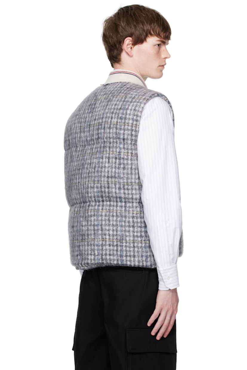 Down-filled and quilted mohair-blend tweed vest.

· Check pattern throughout
· Striped rib-knit stand collar
· Press-stud closure
· Welt pockets at waist
· Press-stud vent at side seams
· Tricolor grosgrain flag at back collar
· Welt pockets at interior
· Full taffeta lining

Supplier color: Blk/Wht

Fill: 80% white goose down, 20% white goose feather.