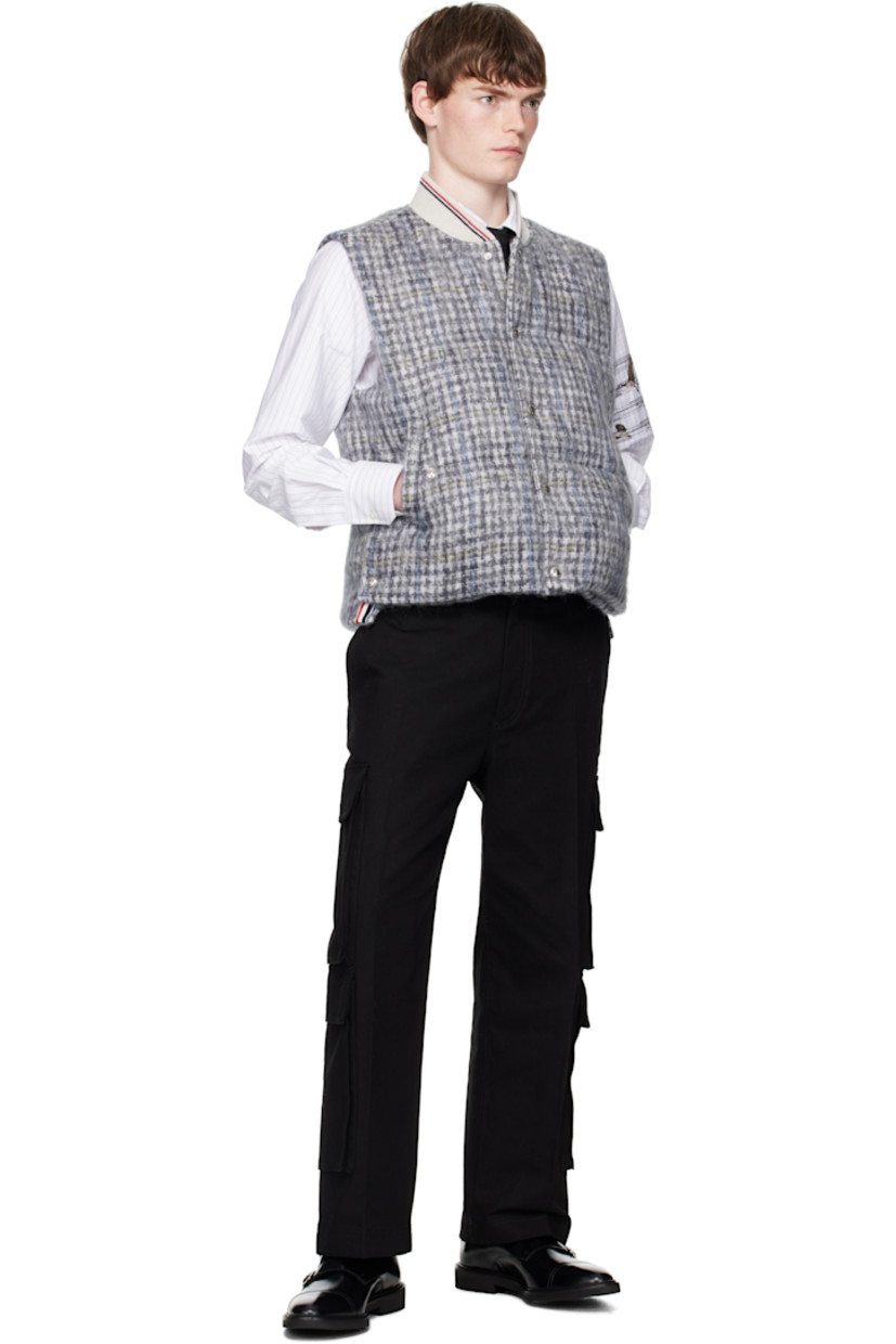 Down-filled and quilted mohair-blend tweed vest.

· Check pattern throughout
· Striped rib-knit stand collar
· Press-stud closure
· Welt pockets at waist
· Press-stud vent at side seams
· Tricolor grosgrain flag at back collar
· Welt pockets at interior
· Full taffeta lining

Supplier color: Blk/Wht

Fill: 80% white goose down, 20% white goose feather.