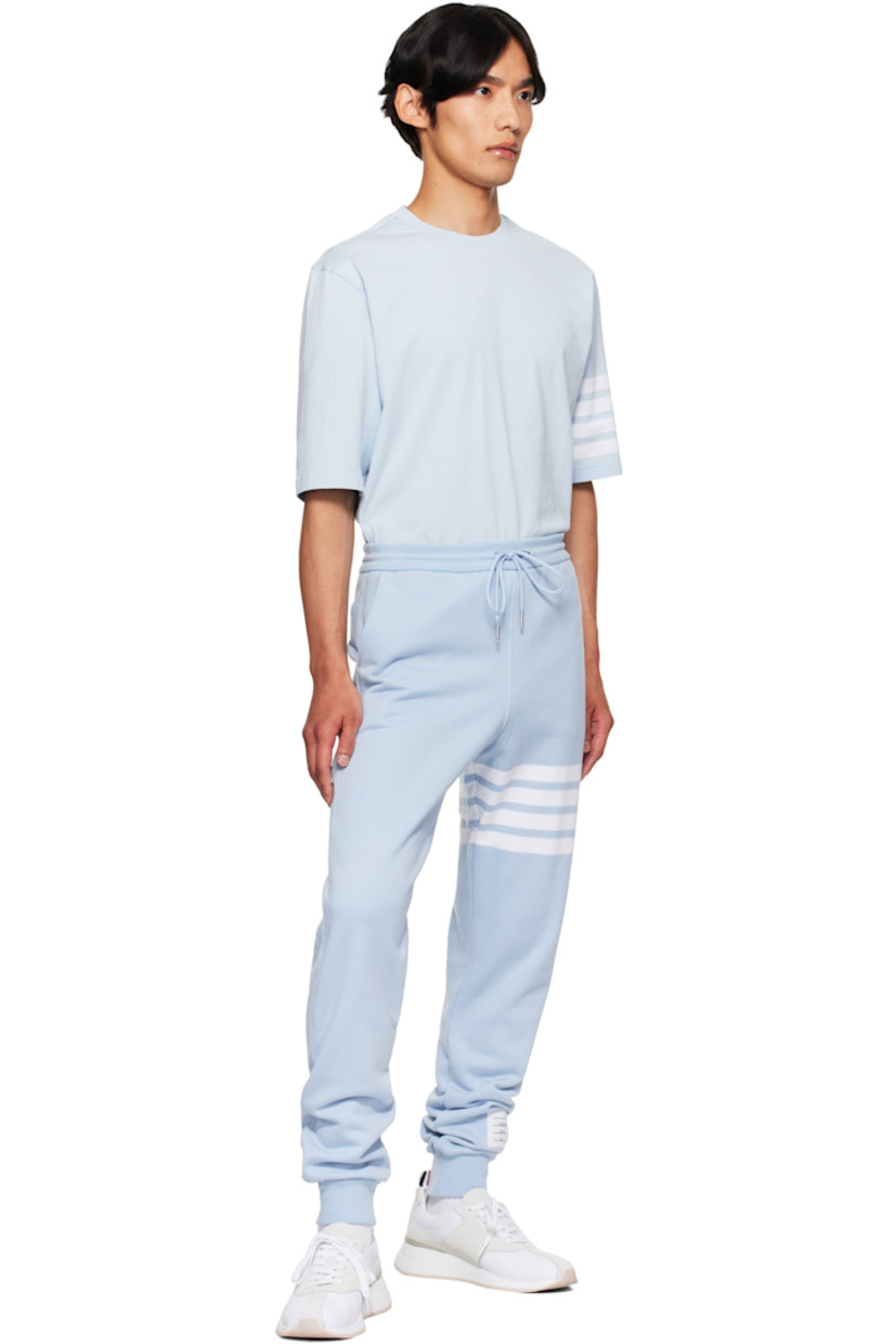 Cotton French terry sweatpants.

· Drawstring at elasticized waistband
· Three-pocket styling
· Stripes at leg
· Logo patch at cuff
· Rib-knit cuffs
· Tricolor grosgrain flag at back waistband

Supplier color: Light blue