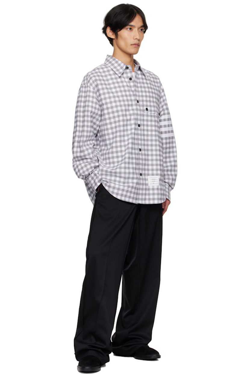 Cotton flannel shirt. 

· Gingham pattern printed throughout 
· Spread collar 
· Button closure
· Flap pocket at waist 
· Logo patch at front hem
· Shirttail hem
· Dropped shoulders
· Buttoned barrel cuffs
· Tricolor grosgrain flag at back collar 
· Locker loop and twin pleats at back yoke 

Supplier color: Med grey