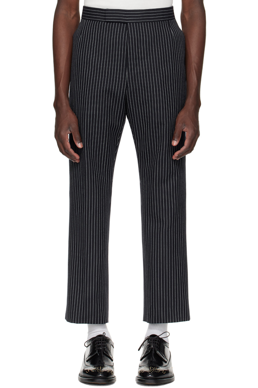Wool tweed trousers. 

· Pinstripes throughout
· Four-pocket styling
· Button fly
· Creased legs
· Adjustable button strap and tricolor grosgrain flag at back
· Full cupro satin lining

Supplier color: Navy