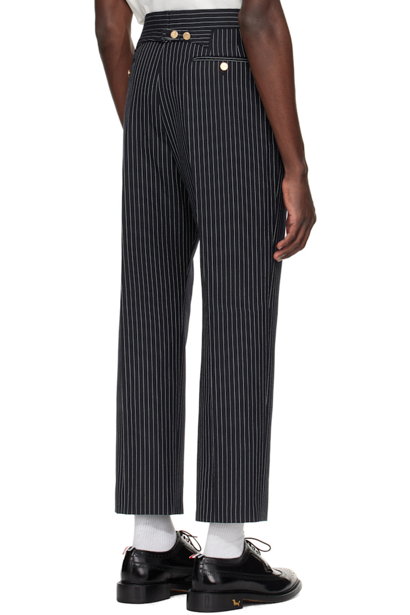 Wool tweed trousers. 

· Pinstripes throughout
· Four-pocket styling
· Button fly
· Creased legs
· Adjustable button strap and tricolor grosgrain flag at back
· Full cupro satin lining

Supplier color: Navy