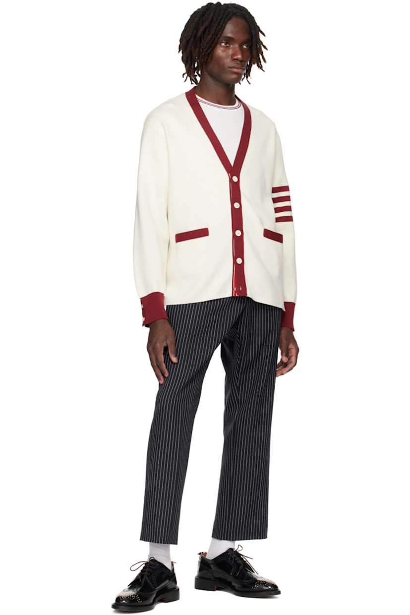 Wool tweed trousers. 

· Pinstripes throughout
· Four-pocket styling
· Button fly
· Creased legs
· Adjustable button strap and tricolor grosgrain flag at back
· Full cupro satin lining

Supplier color: Navy