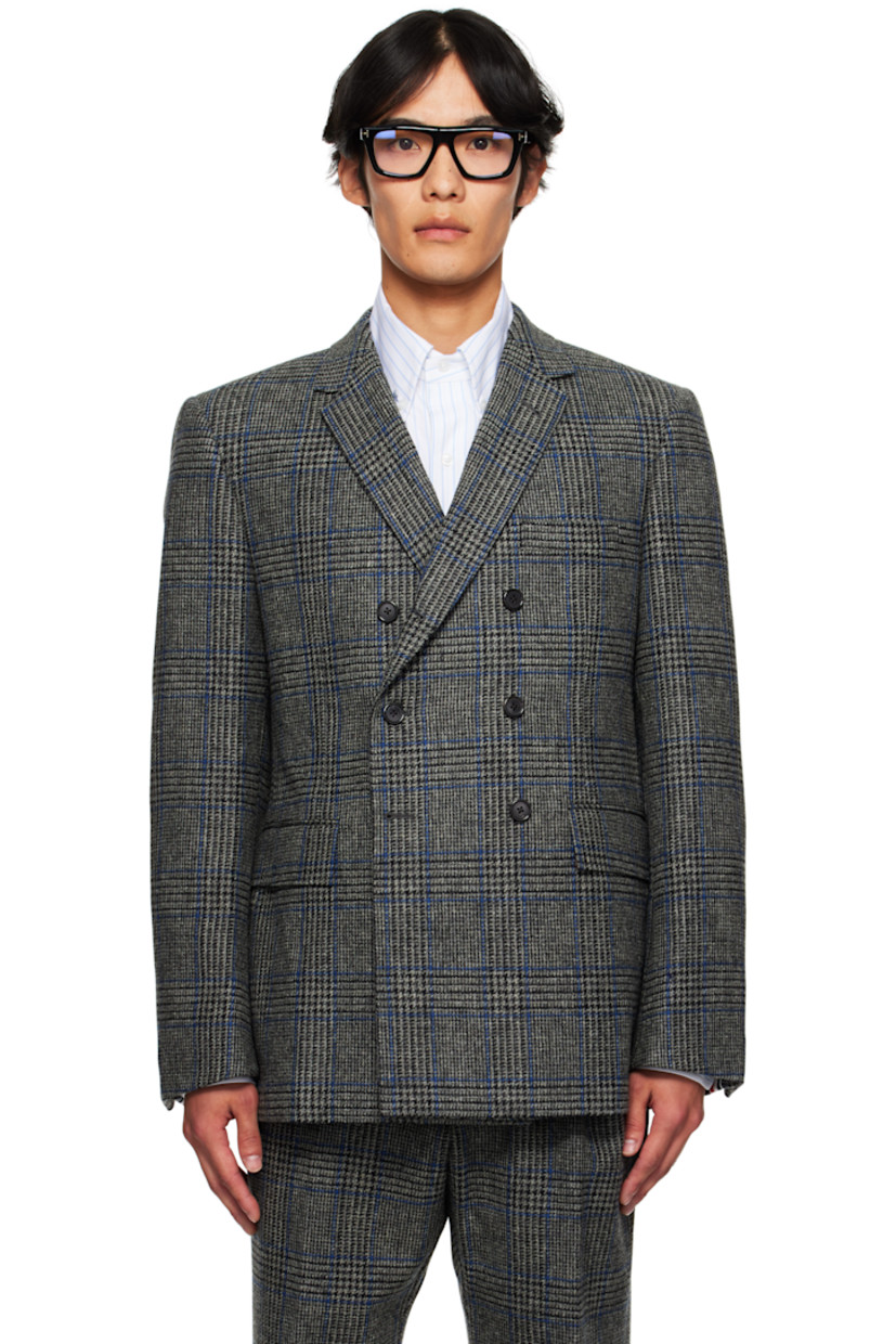 Wool tweed blazer.

· Prince of Wales pattern throughout
· Notched lapel
· Double-breasted button closure
· Welt pocket at chest
· Flap pockets at front
· Padded shoulders
· Buttoned surgeon's cuffs
· Tricolor grosgrain flag at back collar
· Vents at back hem
· Welt pockets and button tab at interior
· Full cupro satin lining

Supplier color: Med grey