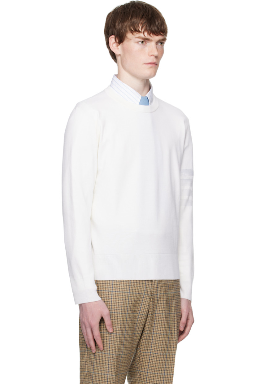 Knit virgin wool-blend sweater.

· Rib-knit crewneck, hem, and cuffs
· Stripes at sleeve
· Tricolor grosgrain flag at back collar

Supplier color: White