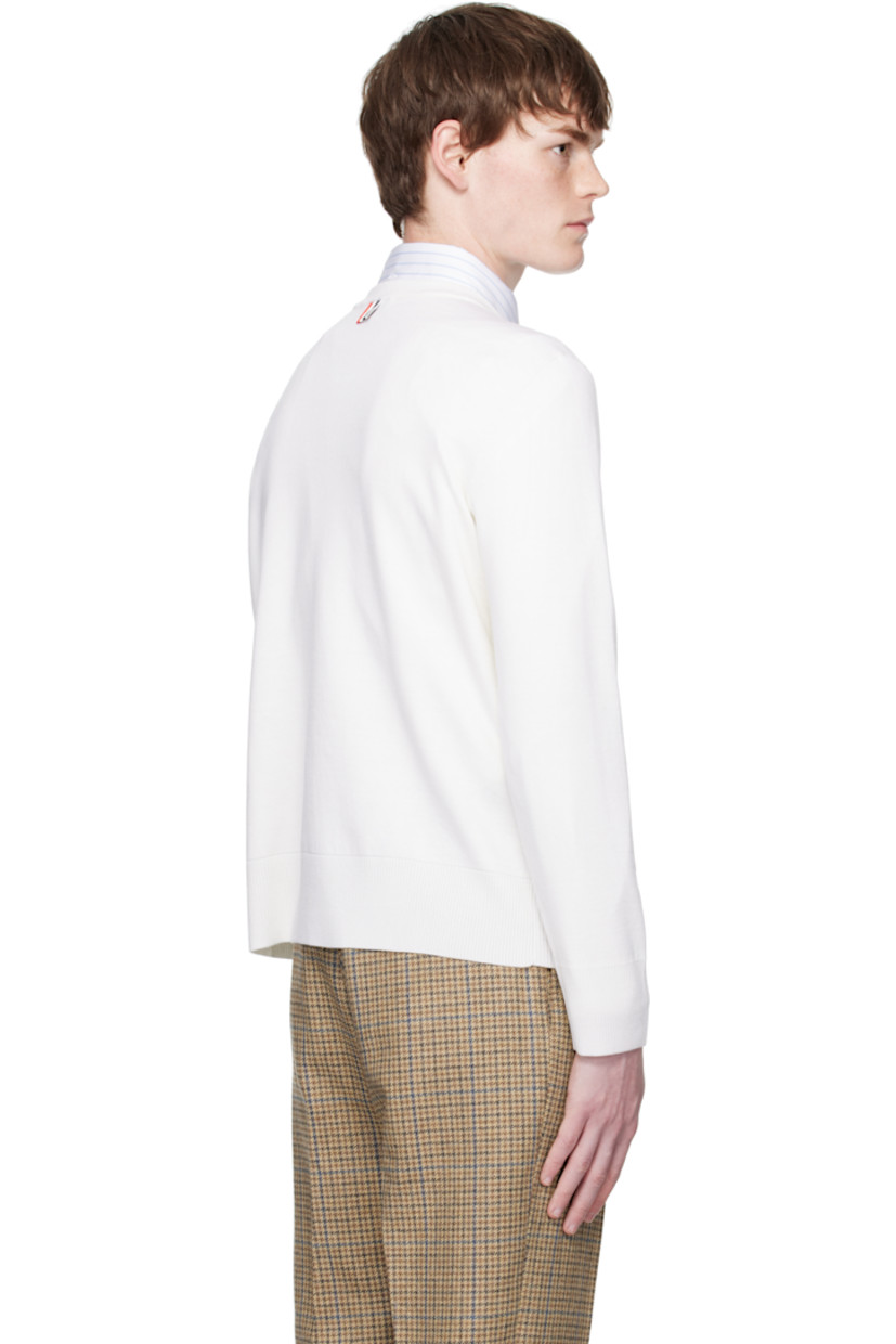 Knit virgin wool-blend sweater.

· Rib-knit crewneck, hem, and cuffs
· Stripes at sleeve
· Tricolor grosgrain flag at back collar

Supplier color: White