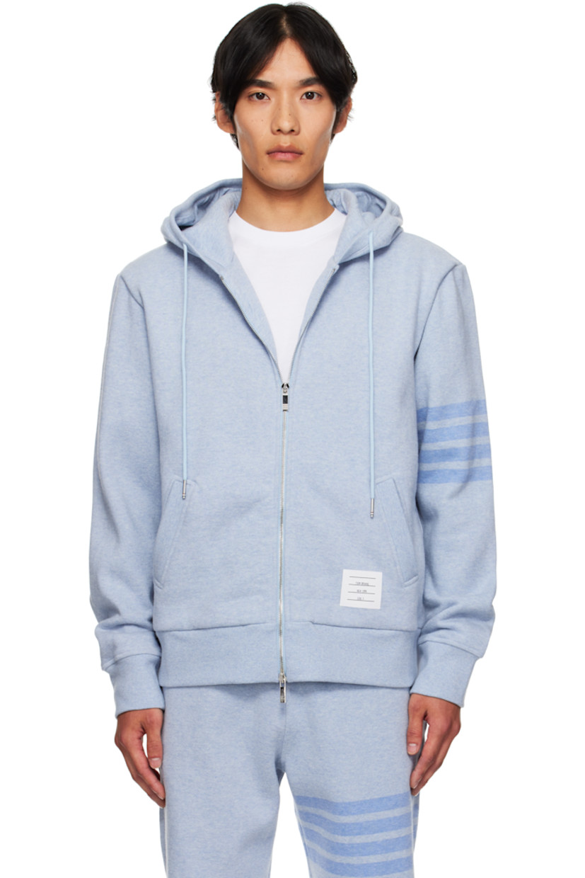 Stretch cotton piqué hoodie.

· Drawstring at hood
· Two-way zip closure
· Logo patch at kangaroo pocket
· Rib-knit hem and cuffs
· Dropped shoulders
· Intarsia stripes at sleeve
· Tricolor grosgrain flag at back collar

Supplier color: Light Blue